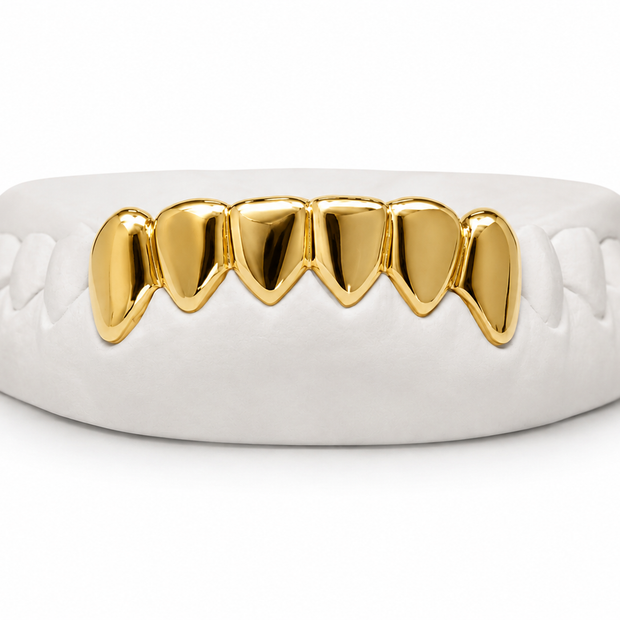 Custom pointed fang bottom grillz in 10K gold