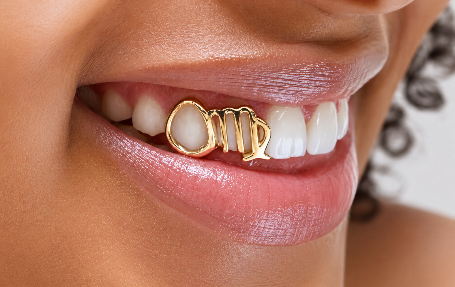Custom Virgo zodiac grillz worn on a smile