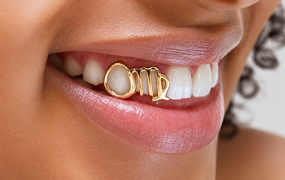 Custom Virgo zodiac grillz worn on a smile